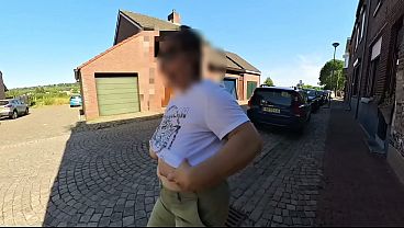A milf with big saggy tits in the street